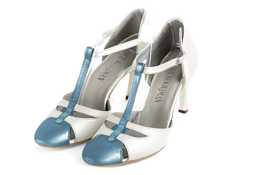 French elegance and refinement for these peacock blue and pure white dress T-strap open side shoes, 
                available in many subtle leather and colour combinations. A pretty model with a comfortable "Salomé" strap and good support.
Its charming spyglass cut-out gives you plenty of scope for personalisation.  
                Matching clutches for parties, ceremonies and weddings.   
                You can customize these shoes to perfectly match your tastes or needs, and have a unique model.  
                Choice of leathers, colours, knots and heels. 
                Wide range of materials and shades carefully chosen.  
                Rich collection of flat, low, mid and high heels.  
                Small and large shoe sizes - Florence KOOIJMAN
